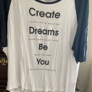 Blue and white top with baseball sleeves/ inspiration wording.